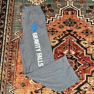 Gray pair size medium jersey, lounge pants with gravity falls down the leg